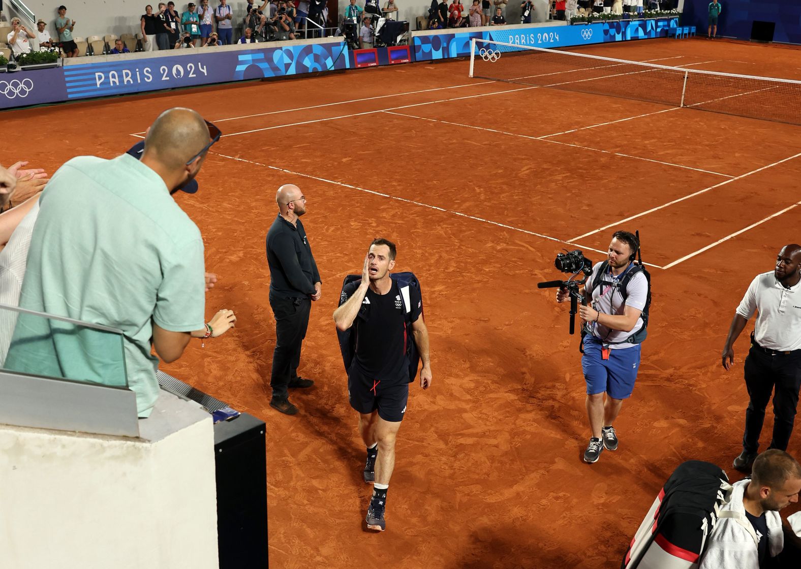 A tearful Andy Murray leaves the court after he and doubles partner Dan Evans <a href="https://www.cnn.com/sport/live-news/paris-olympics-news-2024-08-01-24#h_666b46801978ce38d8ed74bad5a0ca5d">lost in the quarterfinals</a> on August 1. Murray, a three-time grand slam winner, is retiring from the sport.