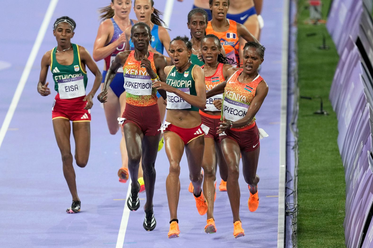 Kenya's Faith Kipyegon, right, fights for the lead during the 5,000-meter final on August 5. Kipyegon was initially disqualified, <a href="https://www.cnn.com/sport/live-news/paris-olympics-news-2024-08-05#h_07263871e6443a968aa928c548399d03">but her silver medal was later reinstated</a>. Kenya's Beatrice Chebet won gold.