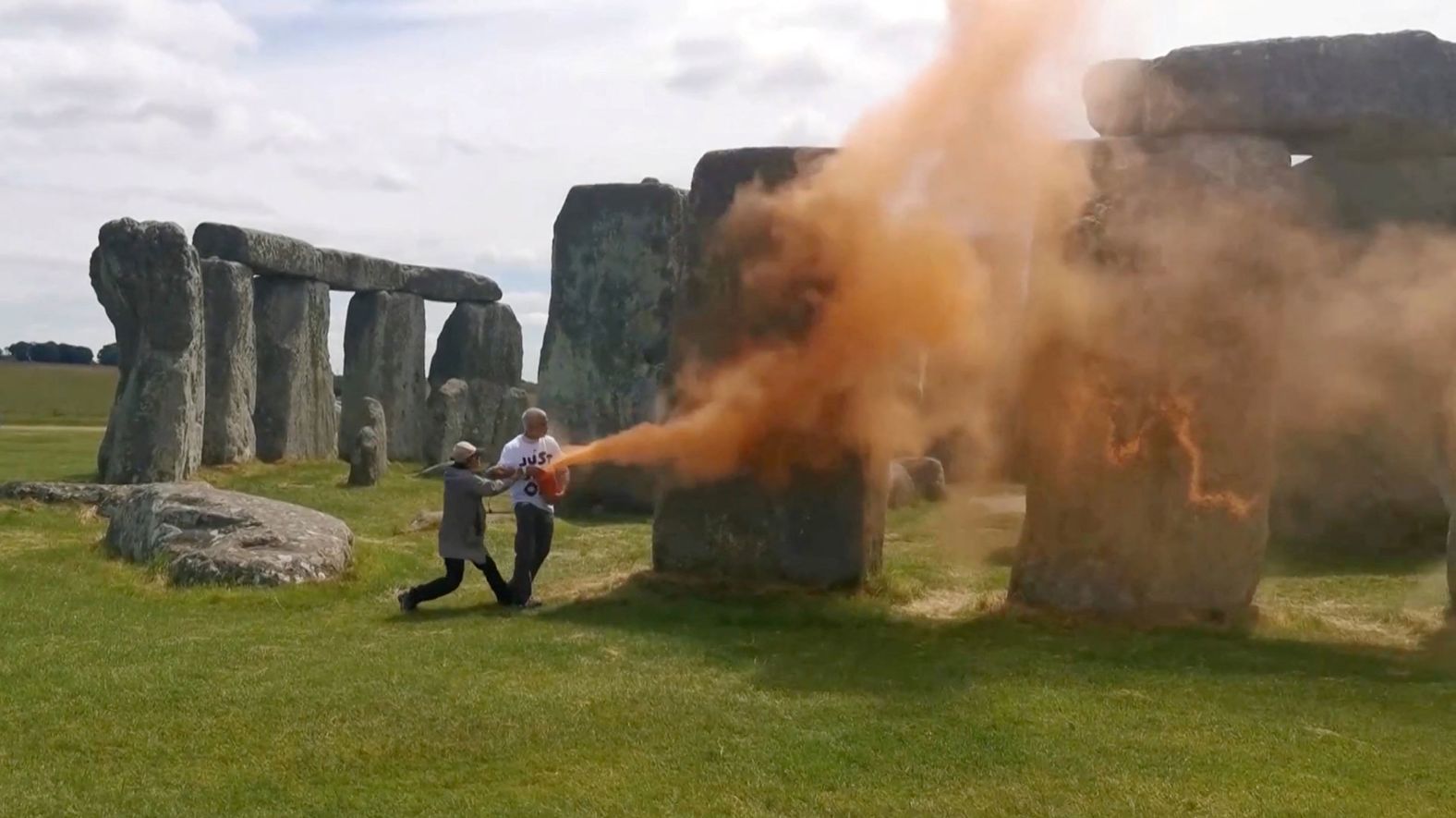In this screengrab taken from video, environmental protesters spray Stonehenge with orange powder paint in Wiltshire, England, on Wednesday, June 19. <a href="https://www.cnn.com/2024/06/19/travel/protesters-spray-stonehenge-paint-gbr-scli-intl/index.html">The paint has since been removed</a>, leaving “no visible damage,” according to the organization that manages the site.