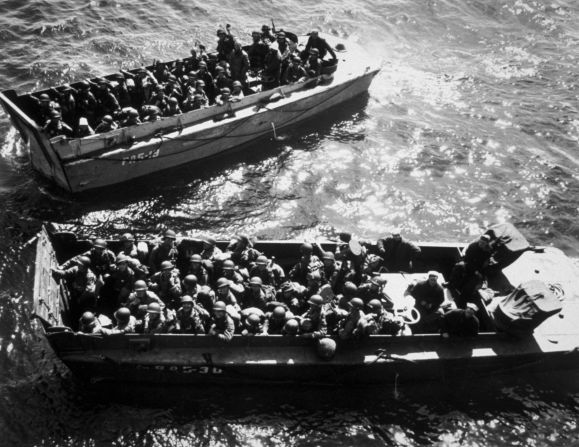 US troops wait to disembark a landing craft on D-Day. The Allies went to elaborate lengths to maintain secrecy and mislead Adolf Hitler. They employed double agents and used decoy tanks and phony bases in England to hide actual troop movements.