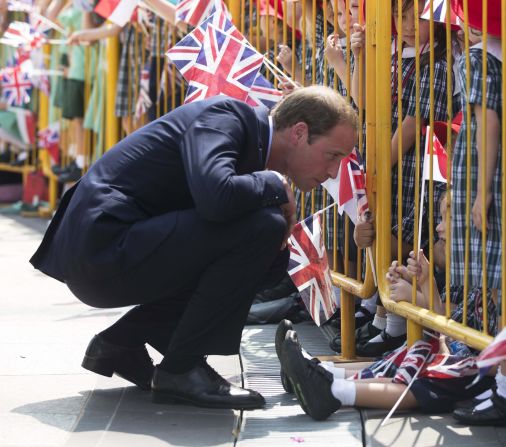 Prince William speaks to a child in the crowd on Wednesday.