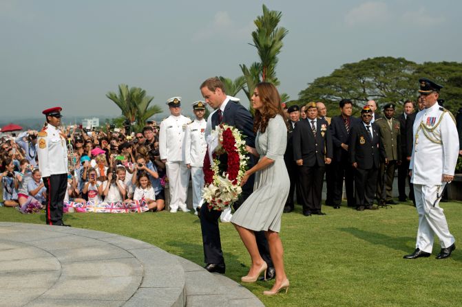 Britain's Prince William and his wife, Catherine, lay a wreath to pay their respects to WWII dead at the Kranji War Cemetery in Singapore Thursday.