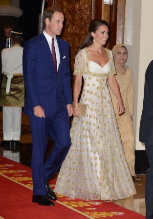 The Duke and Duchess of Cambridge attend an official dinner hosted by Malaysia's Head of State Sultan Abdul Halim Mu'adzam Shah of Kedah at the Istana Negara on Thursday in Kuala Lumpur, Malaysia. The duchess' evening gown, by Alexander McQueen, features the Malaysian flower, hibiscus, in gold detail.