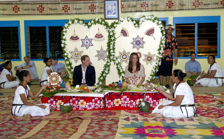 The couple enjoy a traditional dinner at Tausoa Lima Falekaupule on Tuesday in Tuvalu. 