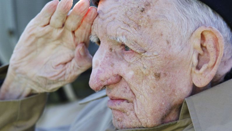 Jesse Beazley, a World War II veteran and D-Day survivor, salutes during the national anthem before a college football game between Kentucky and Missouri in Lexington, Kentucky, on Saturday, November 9. <br /><a href="http://www.cnn.com/2013/11/08/showbiz/gallery/celebrity-vets/index.html">Photos: Celebrities who served</a><br /><a href="http://cnnphotos.blogs.cnn.com/2013/11/08/every-bit-a-woman-every-bit-a-veteran/">Photos: Female veterans</a>