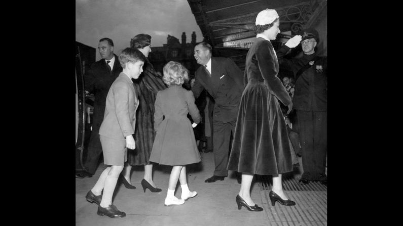 Prince Charles and Princess Anne follow their mother and Princess Margaret in London in 1956.  