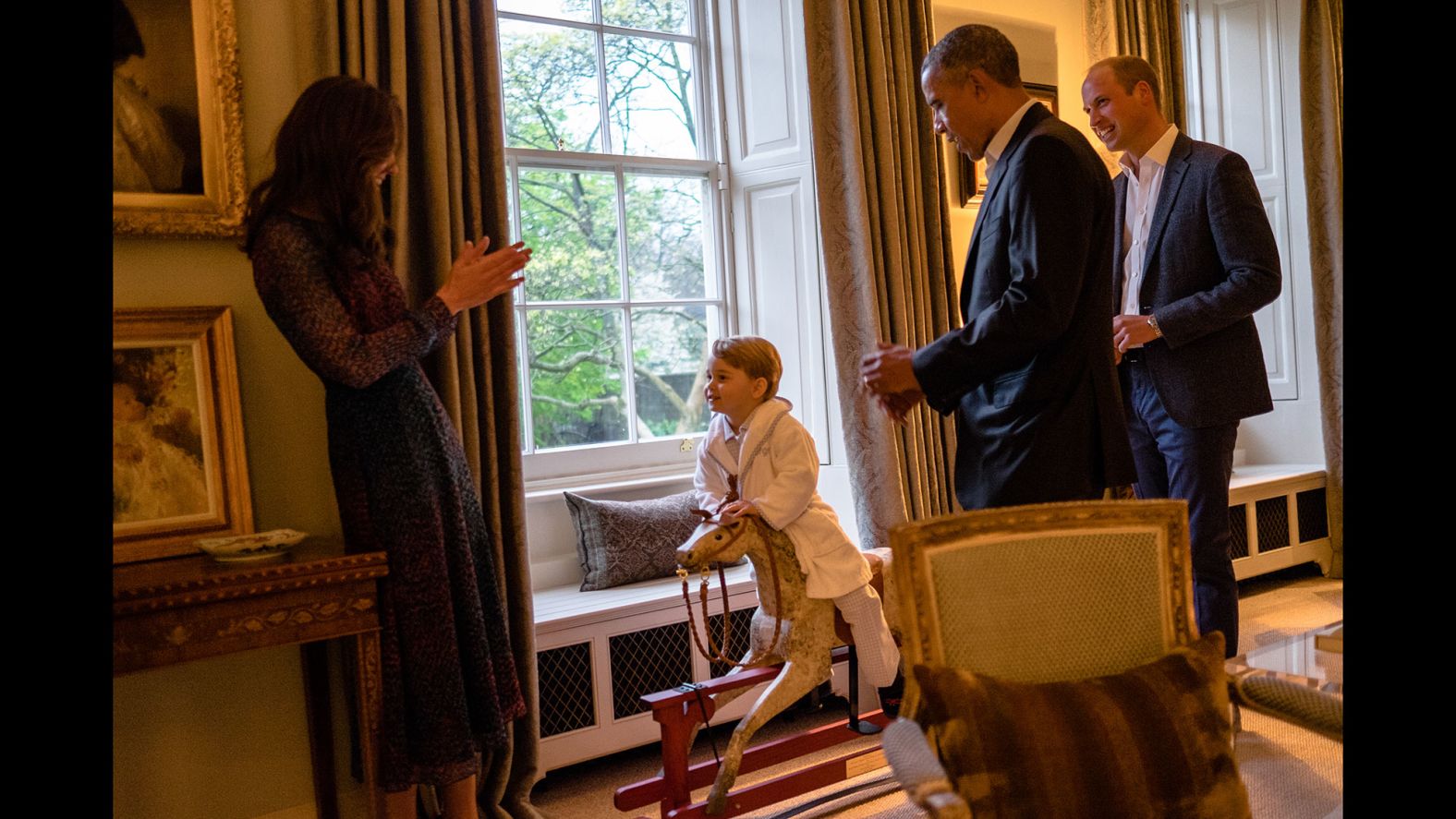 US President Barack Obama talks with Prince William as Catherine plays with Prince George in April 2016. The President and first lady Michelle Obama <a href="http://www.cnn.com/2016/04/18/politics/gallery/obamas-meet-royals/index.html" target="_blank">were visiting Kensington Palace.</a>