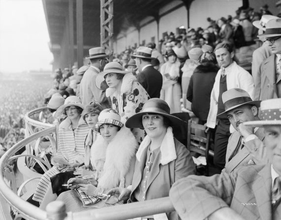 The Derby first launched in 1875, and up until the turn of the 20th century women could be seen wearing hats, gloves, and long dresses down to their ankles.<br />"At any social outing in America at that time, you would have worn a hat and gloves -- and the Kentucky Derby was no different," said Chris Goodlet, Curator of Collections at the <a href="http://www.derbymuseum.org/" target="_blank" target="_blank">Kentucky Derby Museum.</a><br />"Many women would have worn silk because of the warm weather, and be carrying a parasol."<br />This image features race-goers in 1926.