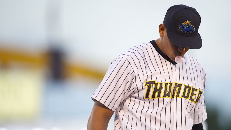 Rodriguez blows a bubble during a minor league game for the AA Trenton Thunder in Trenton, NJ on August 3, 2013. Major League Baseball suspended Rodriguez for <a href="http://www.cnn.com/2013/08/05/us/alex-rodriguez-future/index.html?hpt=hp_t1" target="_blank">211 regular-season games</a> through the 2014 season amid allegations involving the use of performance-enhancing drugs. 