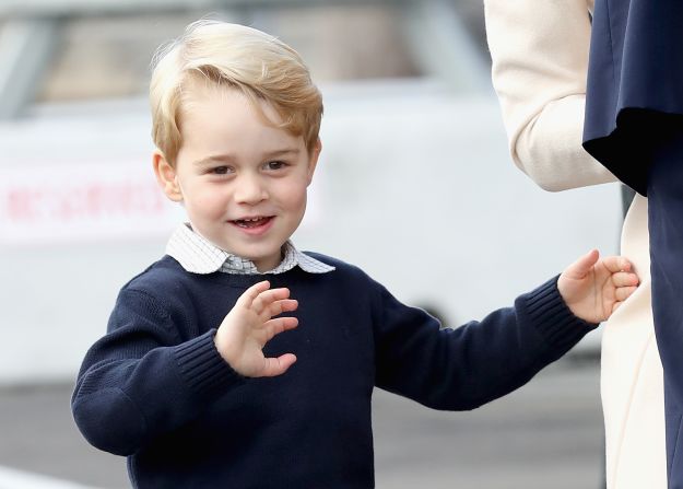 Prince George of Cambridge waves as he leaves from Victoria Harbour to board a sea-plane on October 1.