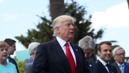  U.S. President Donald Trump (C) and other leaders arrive for the group photo for the G7 Outreach Program on the second and last day of the G7 Taormina summit on the island of Sicily on May 27, 2017 in Taormina, Italy. (Photo by Sean Gallup/Getty Images)