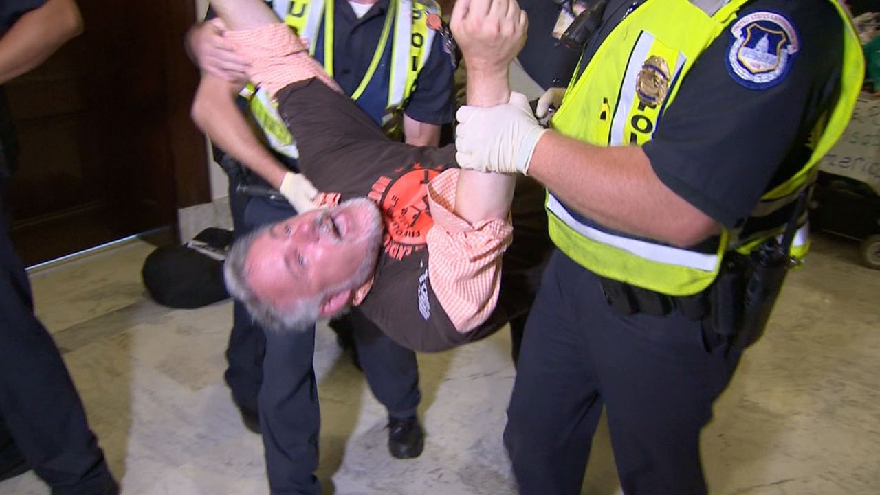 Strong video of protest outside McConnell's office