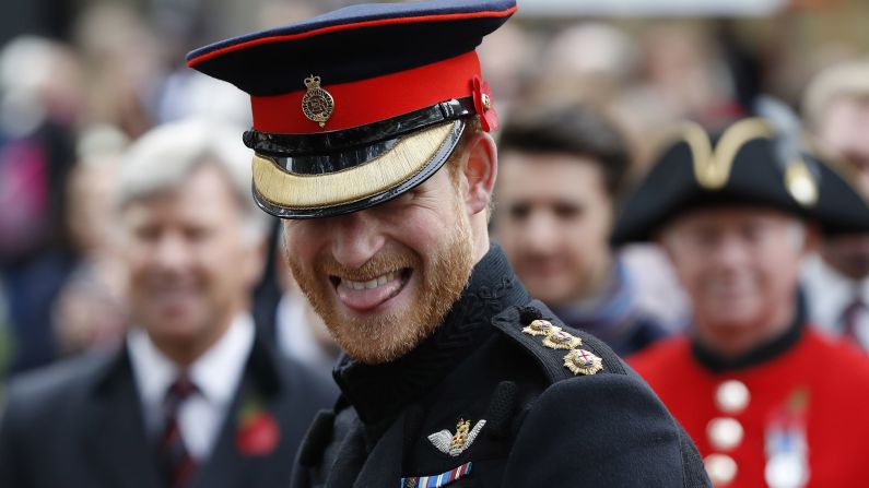 Harry smiles as he speaks to veterans in London in November. He was attending the official opening ceremony of the Field of Remembrance at Westminster Abbey.