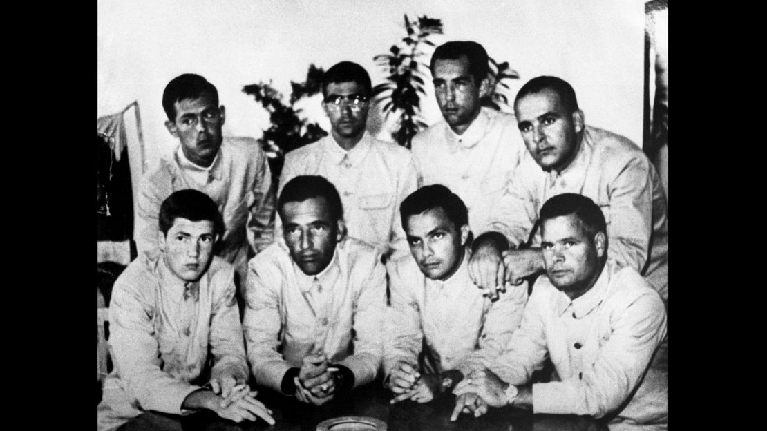 The USS Pueblo crew display their middle fingers in propaganda photos put out by their captors.