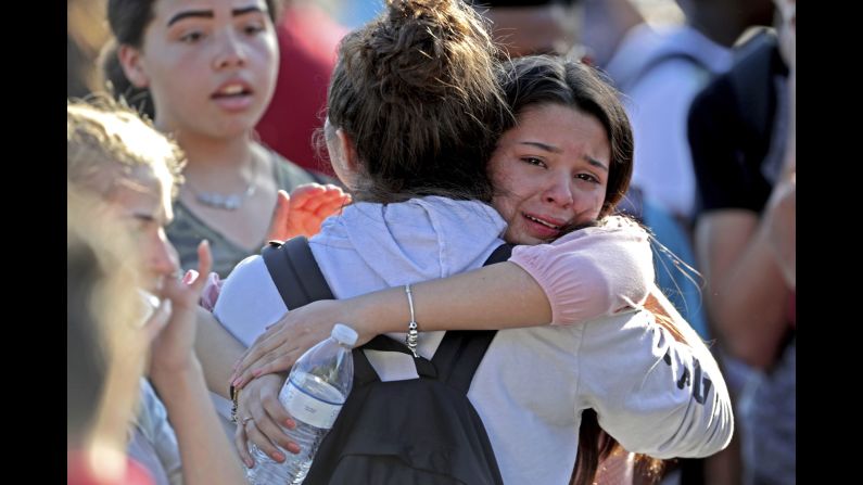 Students released from lockdown console each other. While some students were evacuated, many remained in the school until authorities could come to their aid.