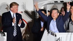 US President Donald Trump (L) applauds as US detainee Kim Dong-chul (2nd R) gestures upon his return with fellow detainees Kim Hak-song and Tony Kim (behind) after they were freed by North Korea, at Joint Base Andrews in Maryland on May 10, 2018. - US President Donald Trump greeted the three US citizens released by North Korea at the air base near Washington early on May 10, underscoring a much needed diplomatic win and a stepping stone to a historic summit with Kim Jong Un. (Photo by Nicholas Kamm / AFP)        (Photo credit should read NICHOLAS KAMM/AFP/Getty Images)