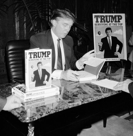 Trump signs his second book, "Trump: Surviving at the Top," in 1990. Trump <a href="http://www.trump.com/publications/" target="_blank" target="_blank">has published</a> at least 16 other books, including "The Art of the Deal" and "The America We Deserve."