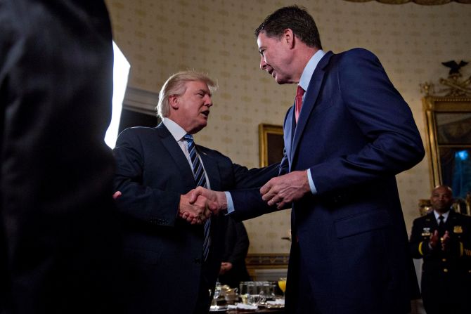 Trump shakes hands with FBI Director James Comey during a White House reception in January 2017. <a href="http://www.cnn.com/2017/05/09/politics/james-comey-fbi-trump-white-out/index.html" target="_blank">Trump fired Comey</a> a few months later, sweeping away the man who was responsible for the FBI's investigation into whether members of Trump's campaign team colluded with Russia in its election interference. The Trump administration attributed Comey's dismissal to his handling of the investigation into Hillary Clinton's email server.