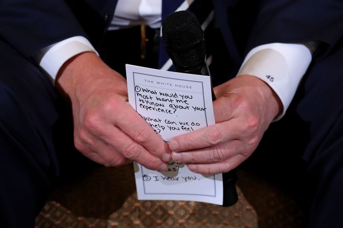 Trump holds his notes while hosting a <a href="https://www.cnn.com/2018/02/21/politics/trump-listening-sessions-parkland-students/index.html" target="_blank">listening session with student survivors</a> of mass shootings, their parents and teachers in February 2018. The <a href="https://www.cnn.com/2018/02/21/politics/trump-parkland-notecard/index.html" target="_blank">visible points included prompts</a> such as "1. What would you most want me to know about your experience?" "2. What can we do to help you feel safe?" and "5. I hear you."