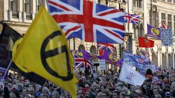 Protesters hold up placards and Union flags as they attend a pro-Brexit rally promoted by UKIP (United Kingdom Independence Party) in central London on December 9, 2018, as the crucial vote on the Brexit deal in the House of Commons looms. - Prime Minister Theresa May appears likely to lose a historic vote on the Brexit deal she has struck with EU leaders in a crucial parliament vote on Tuesday. Defeat in the House of Commons is almost certain to lead to either a no-confidence vote from the opposition or a leadership challenge from within her own Conservative Party. (Photo by Adrian DENNIS / AFP)        (Photo credit should read ADRIAN DENNIS/AFP/Getty Images)