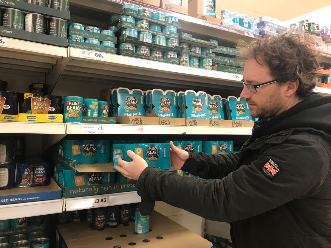 Graham Hughes stockpiles Heinz baked beans for his family at the supermarket.