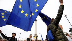 EU supporters, calling on the government to give Britons a vote on the final Brexit deal, wave EU flags as they participate in the 'People's Vote' march in central London, Britain March 23, 2019. REUTERS/Henry Nicholls