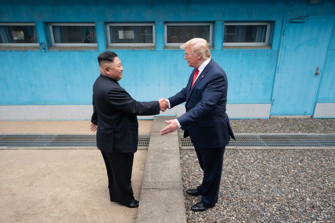 Trump shakes hands with North Korean leader Kim Jong Un as the two <a href="https://www.cnn.com/2019/06/30/world/gallery/trump-kim-north-korea/index.html" target="_blank">meet at the Korean Demilitarized Zone</a> in June 2019. Trump briefly stepped over into North Korean territory, becoming the first sitting US leader to set foot in the nation. Trump said he invited Kim to the White House, and both leaders agreed to restart talks after nuclear negotiations stalled.