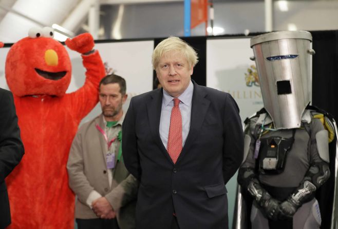 Johnson appears on stage alongside Bobby Smith during the count declaration in London in December 2019. <a href="https://edition.cnn.com/2019/12/13/uk/uk-election-boris-johnson-win-ge19-intl-gbr/index.html" target="_blank">Johnson's Conservative Party won a majority</a> in the UK's general election, securing his position as Prime Minister.