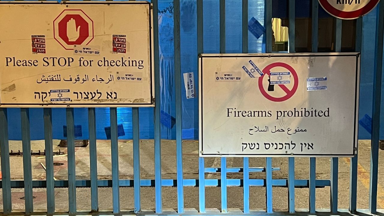 The UNRWA East Jerusalem compound gate is seen plastered with pro-Israeli stickers on May 9, 2024.