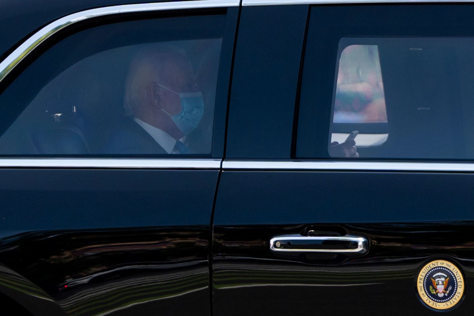 US President Joe Biden wears a mask while returning to the White House from his home in Rehoboth Beach, Delaware, on Tuesday, July 23. He tested positive for Covid-19 last week.