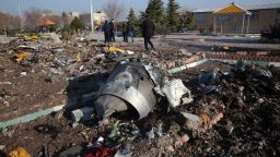 Rescue teams work amidst debris after a Ukrainian plane carrying 176 passengers crashed near Imam Khomeini airport in the Iranian capital Tehran early in the morning on January 8, 2020, killing everyone on board. - The Boeing 737 had left Tehran's international airport bound for Kiev, semi-official news agency ISNA said, adding that 10 ambulances were sent to the crash site. (Photo by - / AFP) (Photo by -/AFP via Getty Images)