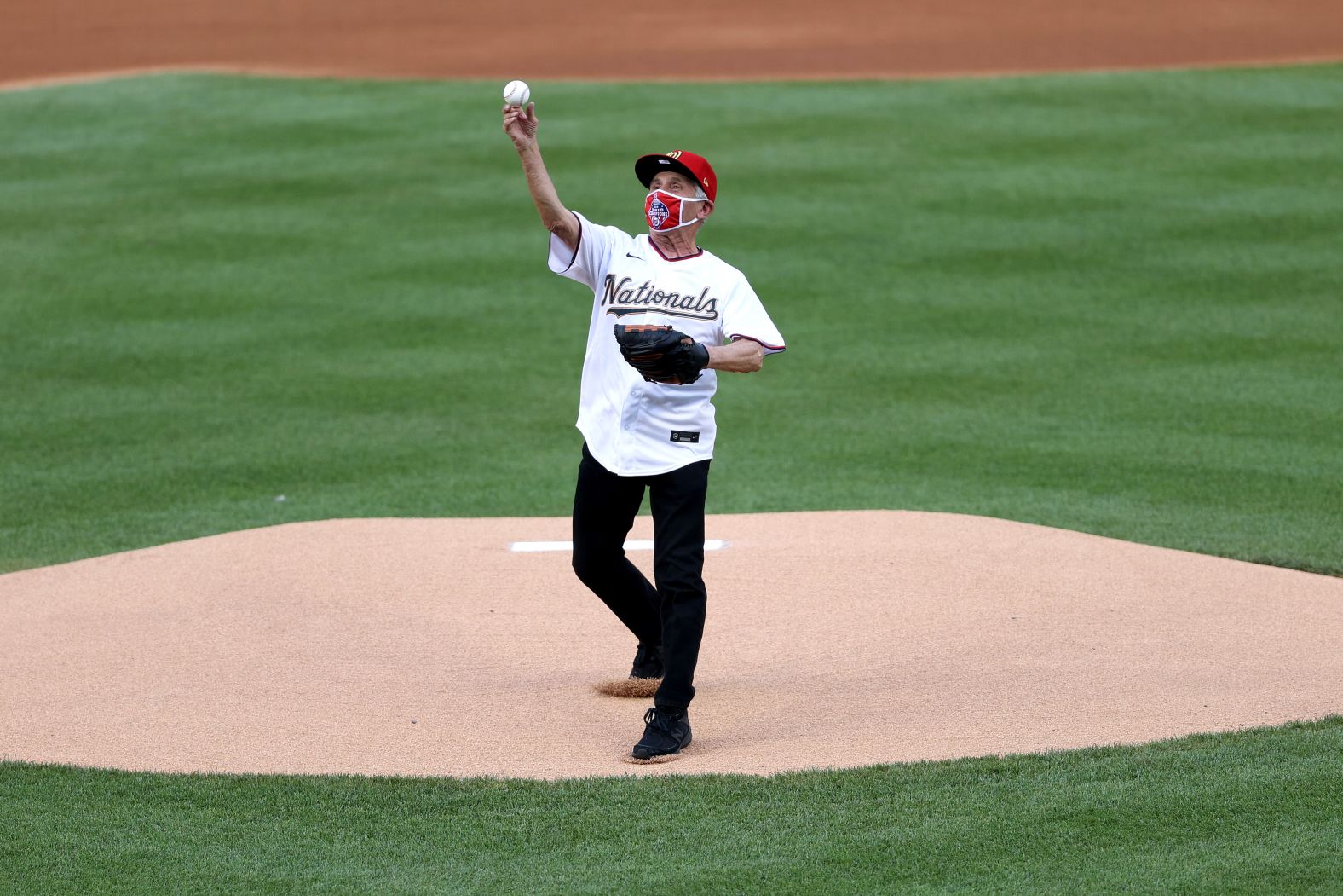 Dr. Anthony Fauci, the director of the National Institute of Allergy and Infectious Diseases, <a href="http://www.cnn.com/2020/07/23/us/fauci-first-pitch-nationals-yankees-trnd/index.html" target="_blank">throws out the ceremonial first pitch</a> before the Nationals-Yankees opener.