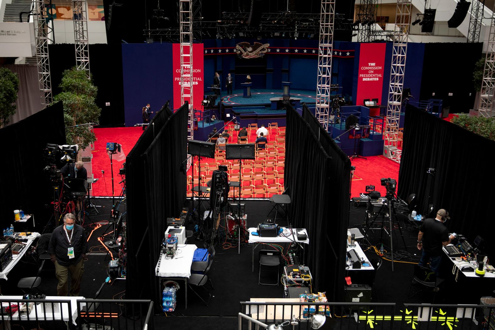 Final preparations take place inside the debate venue.