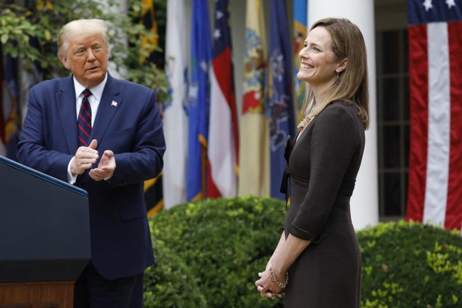 Judge Amy Coney Barrett reacts as Trump <a href="https://www.cnn.com/2020/09/26/politics/amy-coney-barrett-supreme-court-nominee/index.html" target="_blank">introduces her as his Supreme Court nominee</a> in September 2020. <a href="http://www.cnn.com/2020/10/09/politics/gallery/amy-coney-barrett/index.html" target="_blank">She was confirmed</a> a month later by a Senate vote of 52-48.