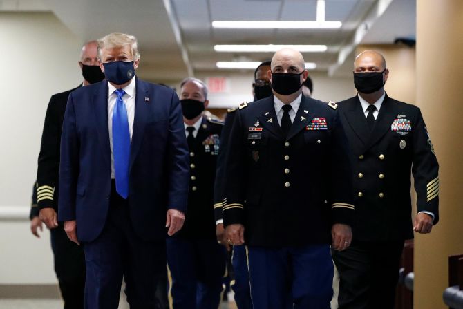 Trump wears a face mask in July 2020 as <a href="https://www.cnn.com/2020/07/11/politics/trump-walter-reed-visit-mask/index.html" target="_blank">he visits the Walter Reed National Military Medical Center</a> in Bethesda, Maryland. This was the first time since the pandemic began that the White House press corps got a glimpse of Trump with a face covering.