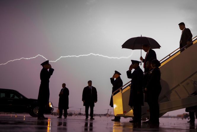 Lightning flashes as Trump exits Air Force One in August 2020. He was returning from a campaign rally in Londonderry, New Hampshire.