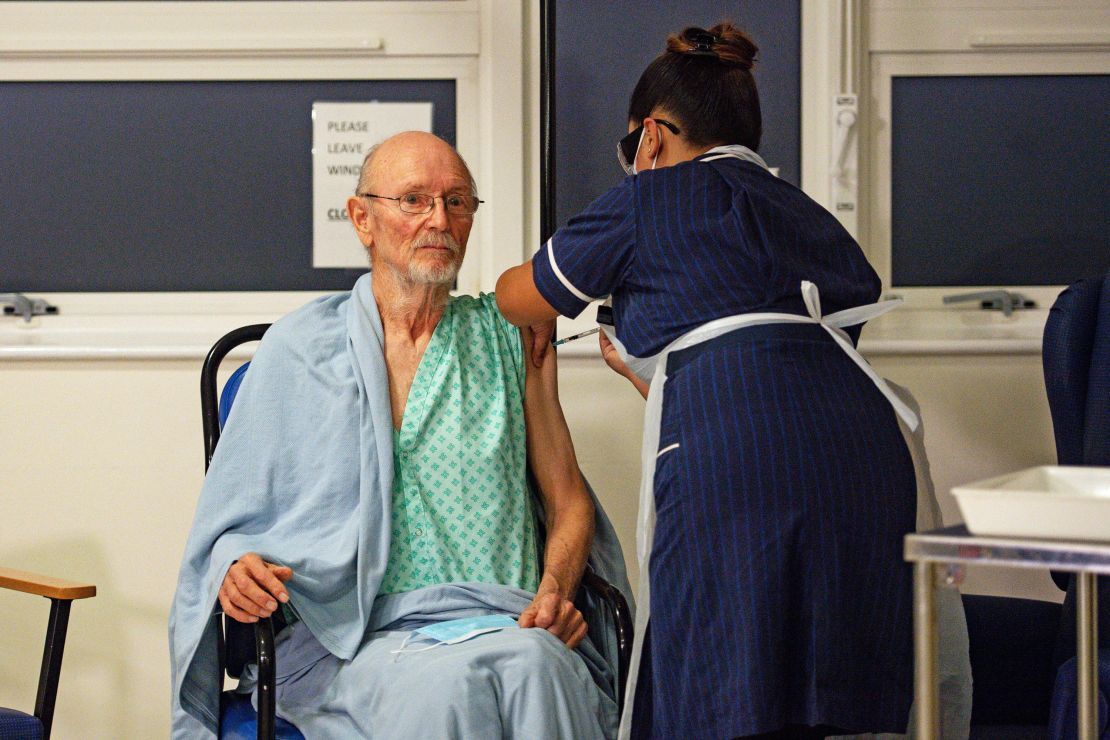 William Shakespere, 81, receives the Pfizer-BioNTech Covid-19 vaccine, at University Hospital, Coventry, England on Tuesday.