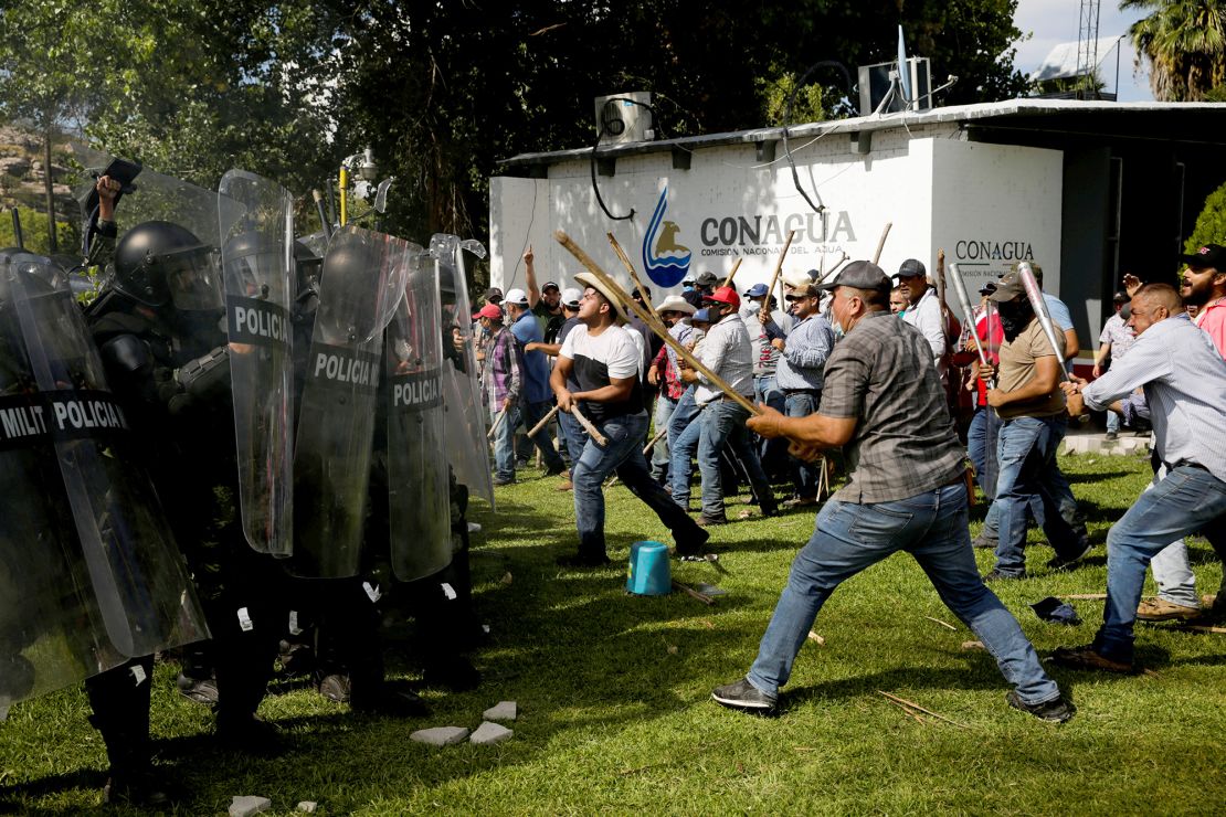 Farmers clash with the Mexican National Guard during a protest against the decision to divert water from La Boquilla dam to the US, in Camargo, Chihuahua state, Mexico, September 8, 2020.