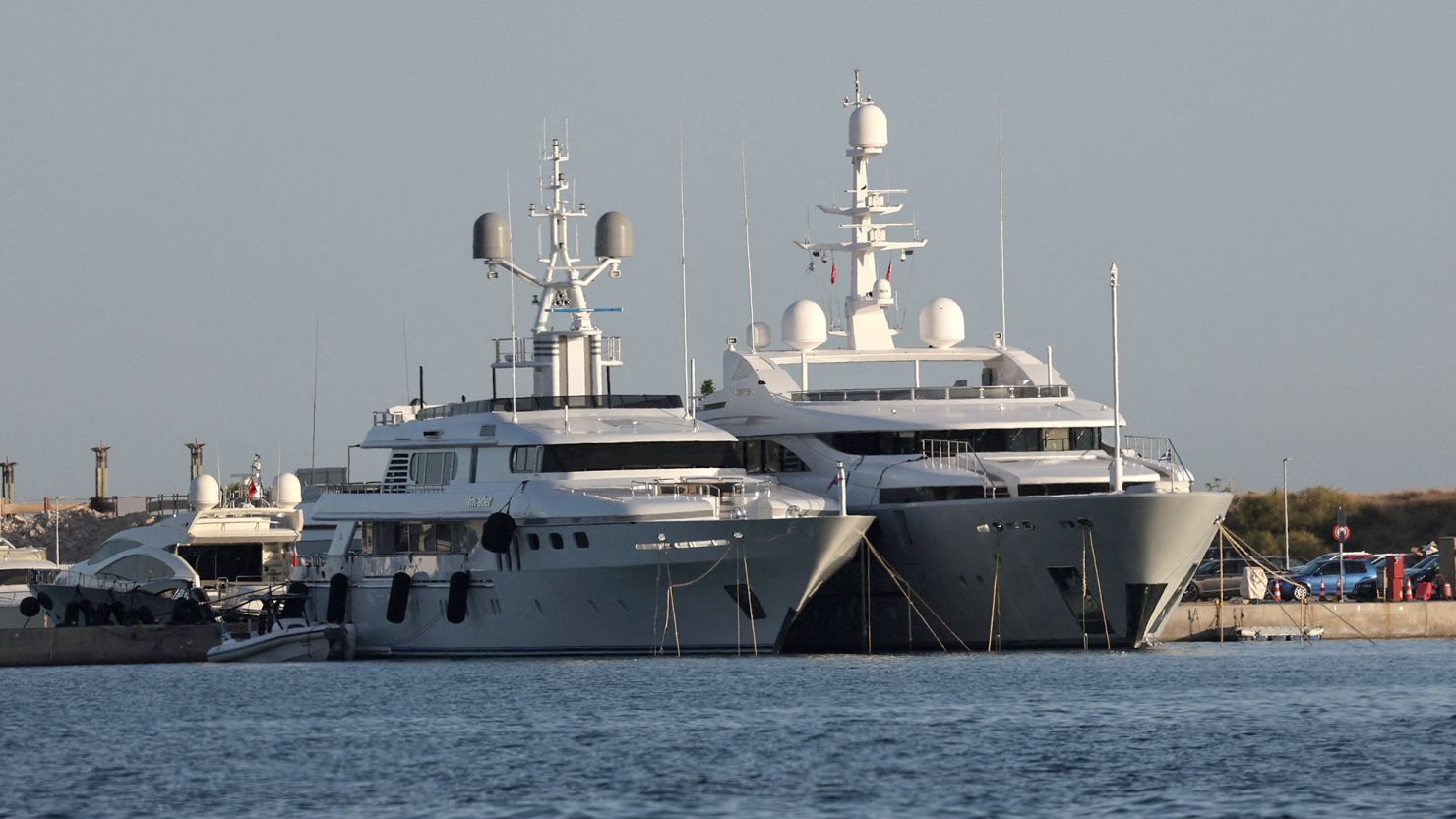 A view of the yacht (right) whose crew members allegedly caused a huge fire with fireworks on the island of Hydra, pictured on June 23. The blaze tore through nearly 300,000 square metres of forest last week.