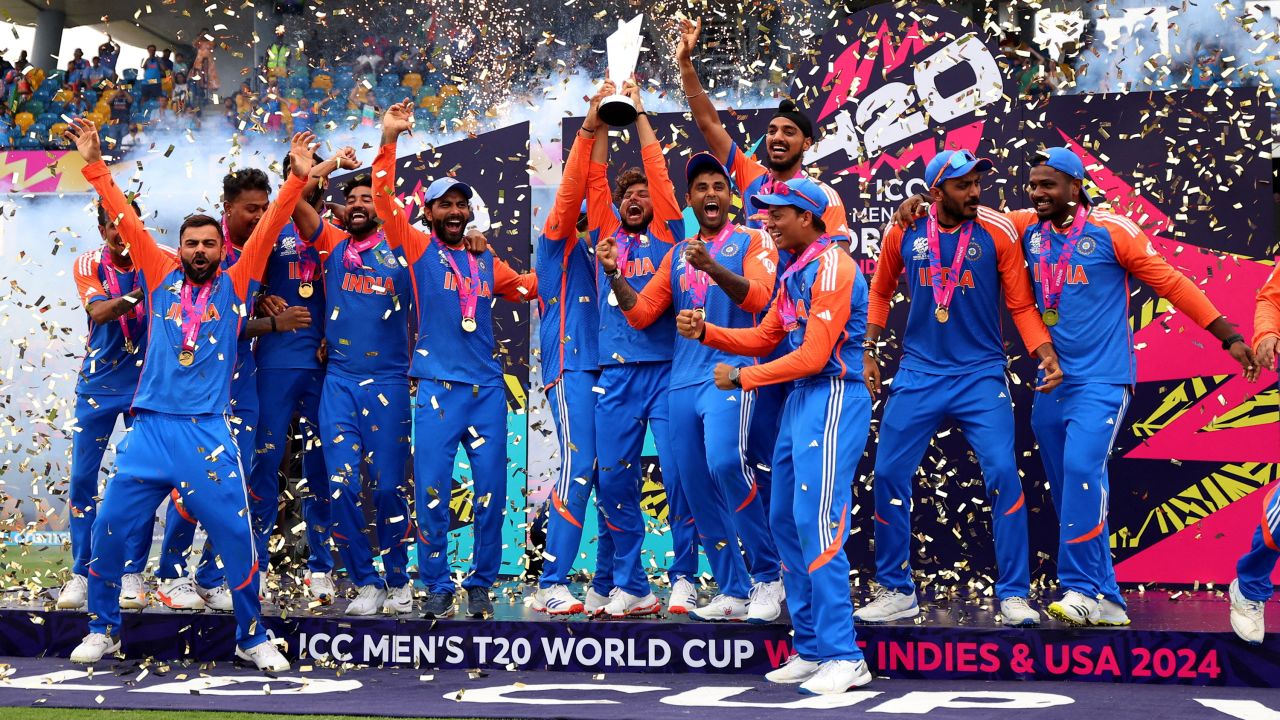 Kuldeep Yadav lifts the T20 World Cup trophy as India celebrate in Bridgetown, Barbados, on June 29.