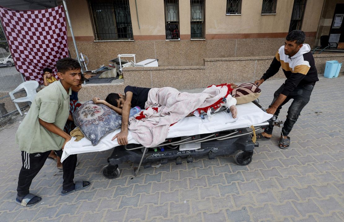 Ali Abu Ismehan, a wounded Palestinian evacuated from the Gaza European Hospital after the Israeli military ordered residents to leave neighborhoods in the eastern part of Khan Younis, is wheeled on a bed at Nasser hospital, also in Khan Younis, on Monday.