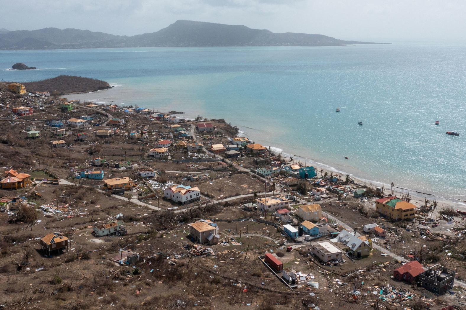 Homes are damaged on the island of Petite Martinique on Tuesday.