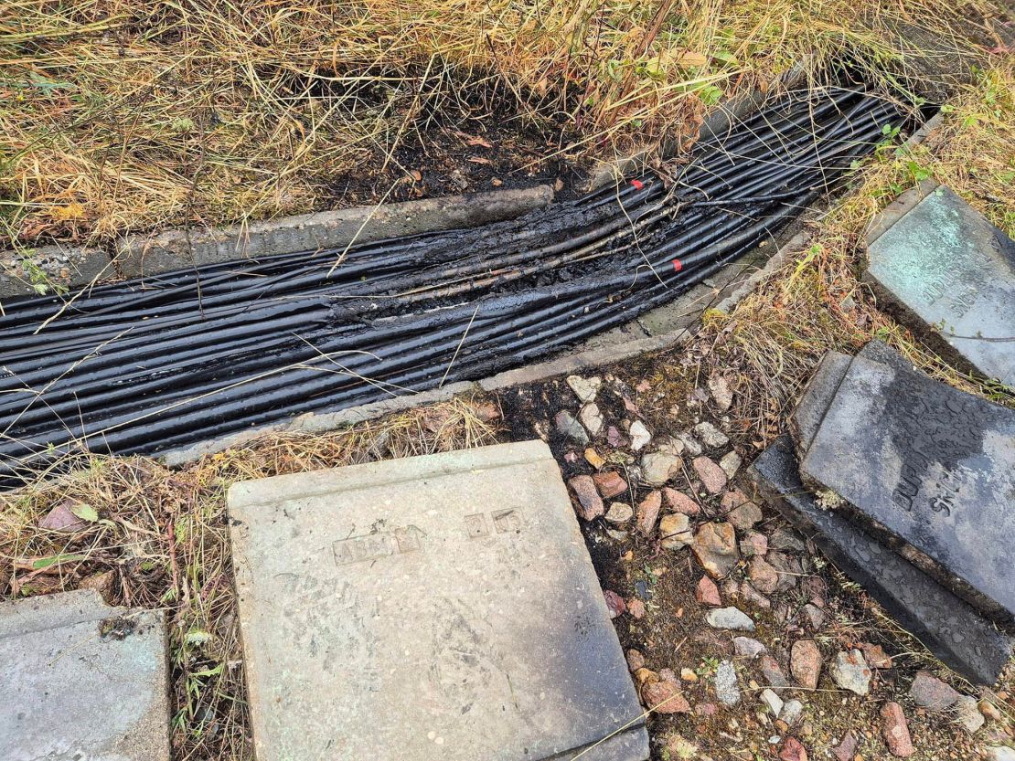 Damaged cables lie near Courtalain, France, near the site where vandals targeted France's high-speed train network, on July 26.