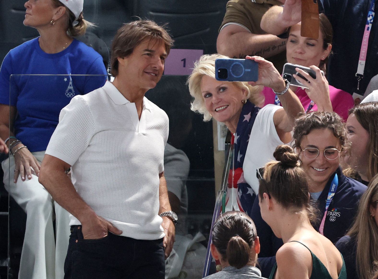 Actor Tom Cruise takes a photo with a fan during the women's gymnastics qualification round on July 28. <a href="https://www.cnn.com/sport/live-news/paris-olympics-news-2024-07-28#h_0f096a6923ada737f3dadf40a552b03b">Other celebrities watching</a> included Snoop Dogg and Ariana Grande.