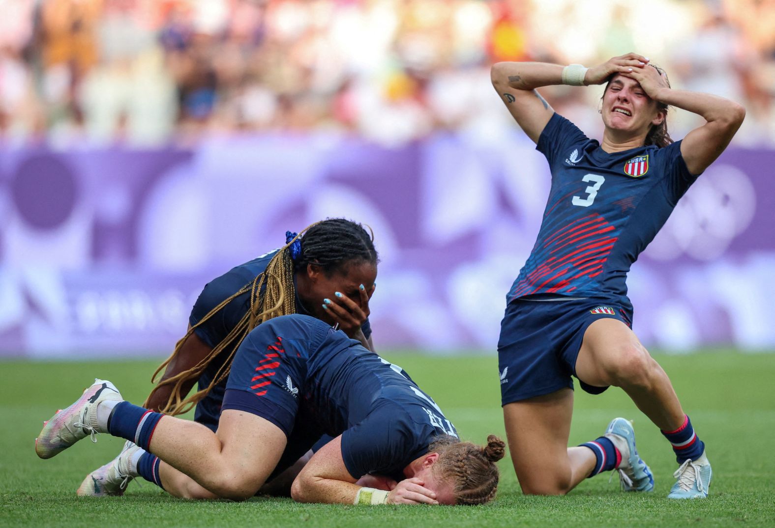 The United States' Naya Tapper, Alev Kelter and Kayla Canett celebrate after their team finished a <a href="https://www.cnn.com/sport/live-news/paris-olympics-news-2024-07-30#h_a8e7c39d4a65b9cf1b5bb249e6971af3">stunning comeback to defeat Australia</a> and win bronze in rugby sevens on July 30. It is the the United States' first-ever Olympic medal in the sport — for either men or women.