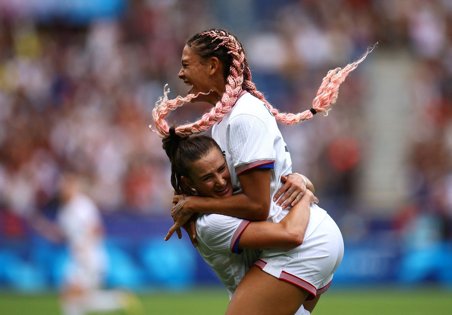 US forward Trinity Rodman, right, celebrates with teammate Emily Fox after scoring a goal against Japan on August 3. The Americans needed extra time to win 1-0 and <a href="https://www.cnn.com/sport/live-news/paris-olympics-news-2024-08-03#h_8e0bb6ea63316728231cf3ccd5032466">advance to the semifinals</a>.