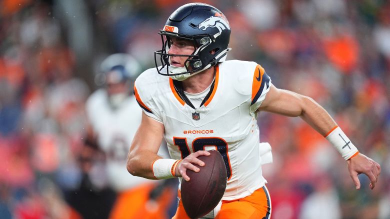 Aug 18, 2024; Denver, Colorado, USA; Denver Broncos quarterback Bo Nix (10) scrambles with the ball in the first quarter against the Green Bay Packers at Empower Field at Mile High. Mandatory Credit: Ron Chenoy-USA TODAY Sports