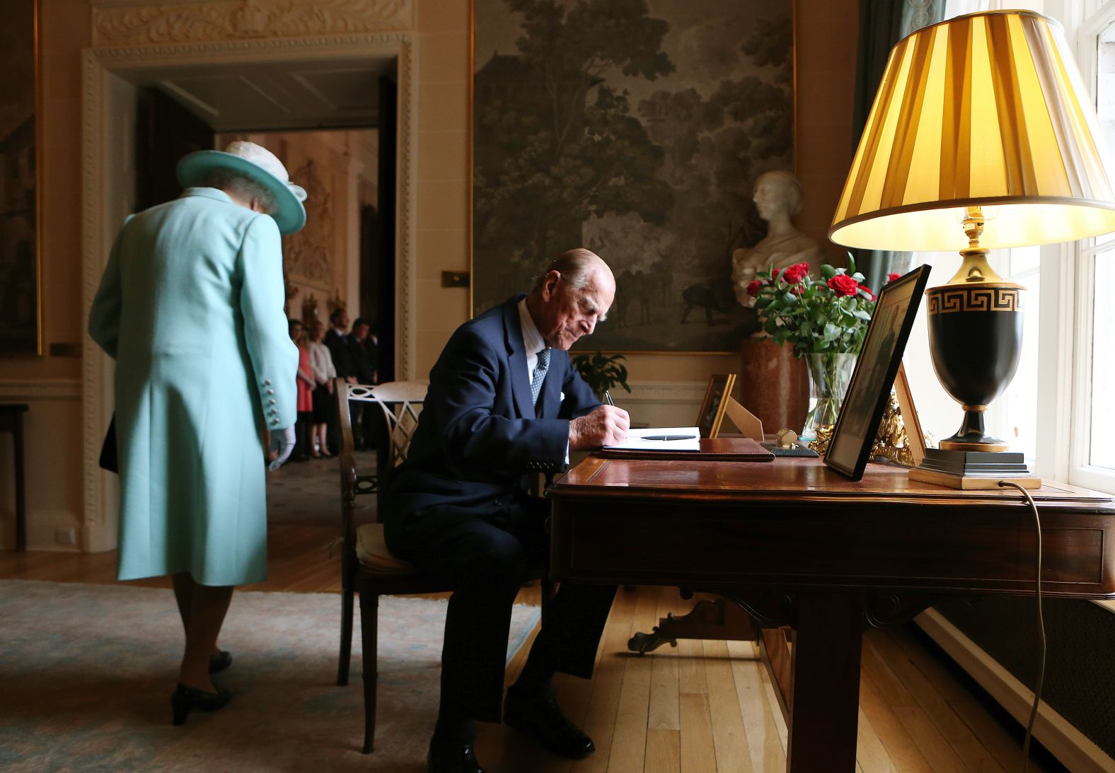 Prince Philip signs the guest book at Hillsborough Castle in Belfast, Northern Ireland, in June 2014.