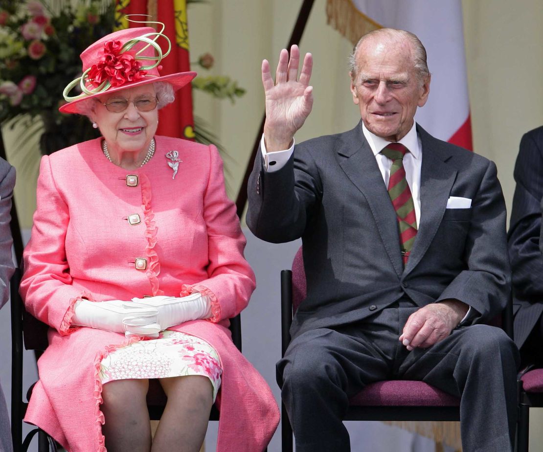 Queen Elizabeth and Prince Philip watch a Diamond Jubilee Pageant during a visit to RAF Cosford in Wolverhampton, England, as part of the Queen's Jubilee Tour of the UK, in July 2012.