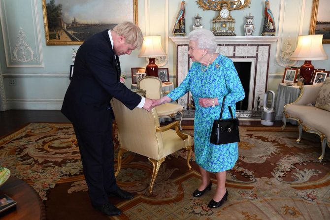 The Queen welcomes Boris Johnson at Buckingham Palace, where she formally invited him to become prime minister in July 2019. Johnson <a href="https://edition.cnn.com/2019/07/23/uk/boris-johnson-prime-minister-uk-gbr-intl/index.html" target="_blank">won the UK's Conservative Party leadership contest</a> and replaced Theresa May, who was forced into resigning after members of her Cabinet lost confidence in her inability to secure the UK's departure from the European Union.